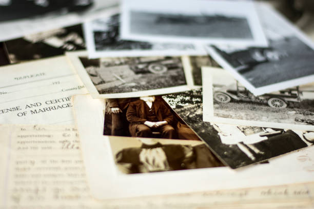 Old Genealogy Family History Photographs and Documents 2 Genealogy family history theme with old family photos and documents. family tree stock pictures, royalty-free photos & images