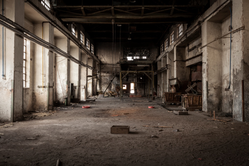 Old abandoned industrial building. Legacy of the main hall in foundry factory.