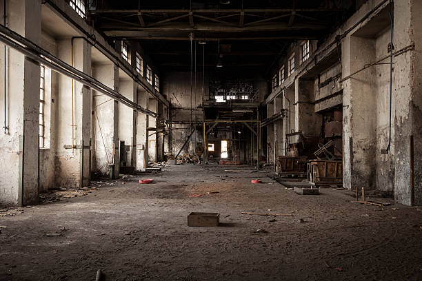 Old industrial building Old abandoned industrial building. Legacy of the main hall in foundry factory. industrial building photos stock pictures, royalty-free photos & images