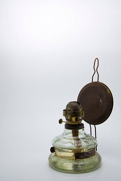 Old kerosene lamp isolated on white background stock photo