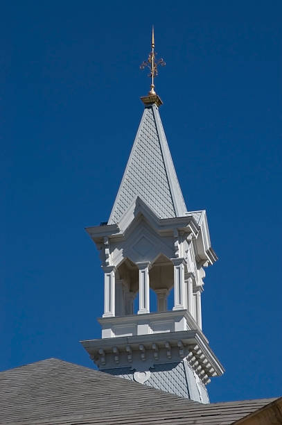 Old Main at Baylor University Rooftops and cupolas of Old Main on the campus of Baylor University framed against a solid blue sky.  The building is designed to reflect the Victorian era. baylor football stock pictures, royalty-free photos & images