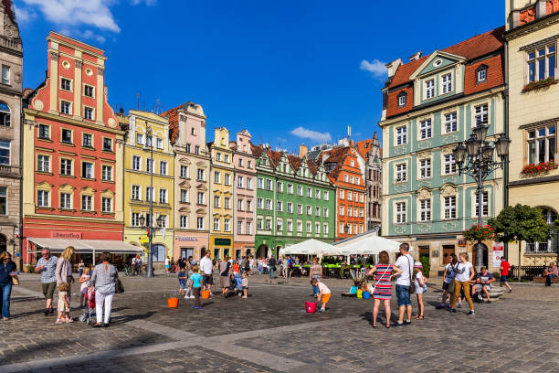 Old market square with tourist in Wroclaw, Poland Wroclaw, Poland - August 18, 2016:Old market square with large number of restaurants with tourists, Wroclaw, Poland wroclaw stock pictures, royalty-free photos & images
