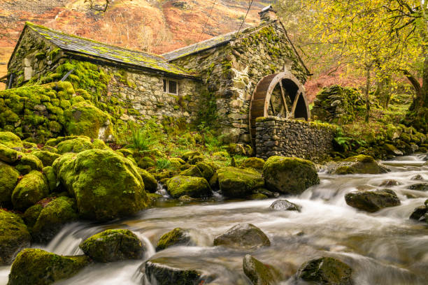 Old mill Old mill with a waterwheel built in the early 1800's in Borrowdale in the Lake District, Uk water wheel stock pictures, royalty-free photos & images