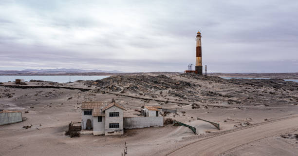 Old outbuildings near Diaz Point lighthouse, Luderitz, in Namibia stock photo