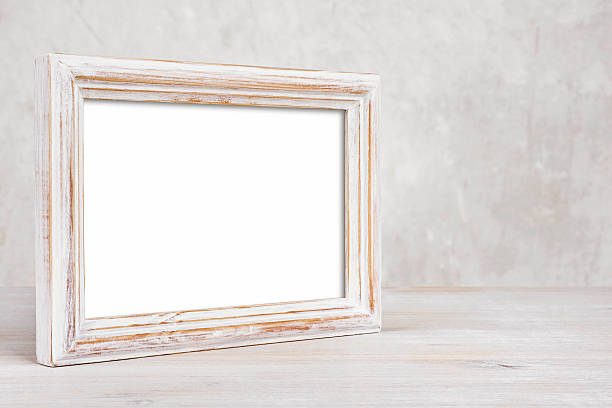 Old painted photo frame on table over abstract background Old painted photo frame on table over abstract background construction frame photos stock pictures, royalty-free photos & images