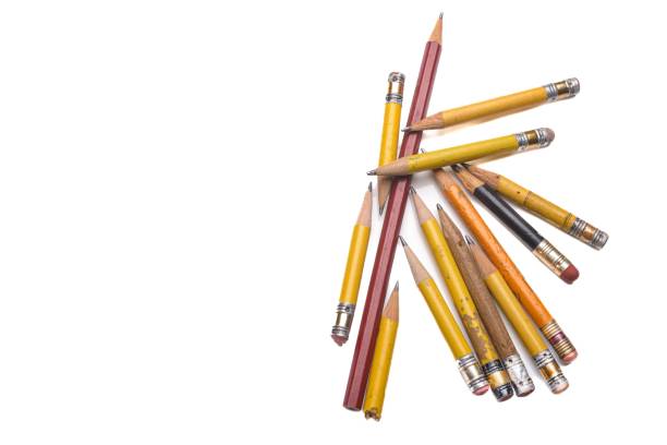 Old pencils on white background stock photo