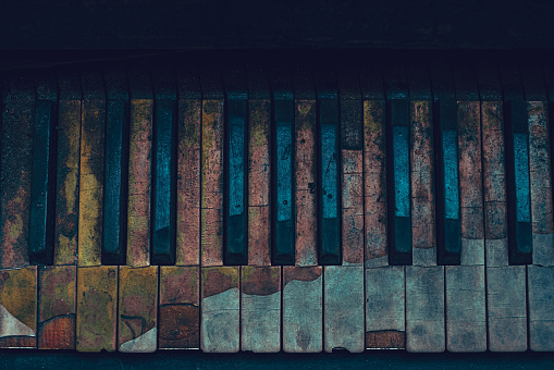 Overhead view of Old Piano Keys in very bad condition