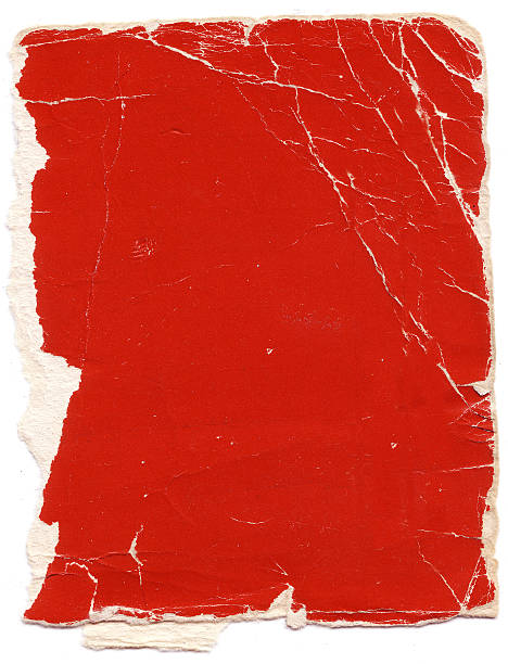 Old piece of tattered red paper stock photo