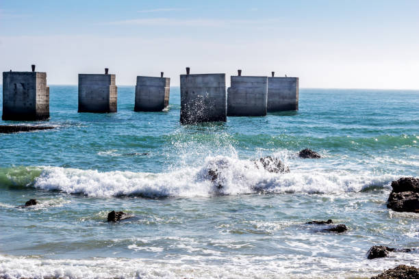 Old pier at Humewood Beach in Port Elizabeth - Waves and ocean at beach stock photo
