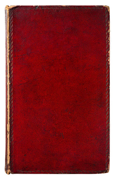 Old red leather bound book on white stock photo