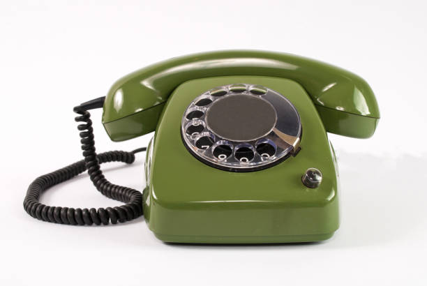 Old retro green phone isolated on white background in studio stock photo