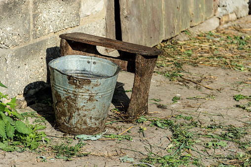 Old Rusty Bucket In The Field By The Pile Of Mud And Soil Stock Photo -  Download Image Now - iStock