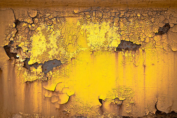 Old rusty gold paint crack metal plate texture background stock photo