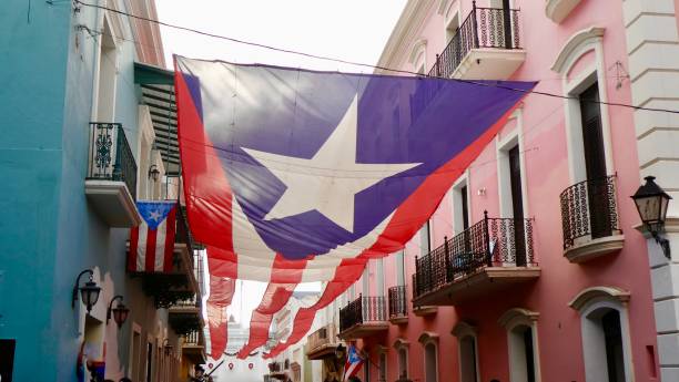 Old San Juan Street Celebration banner in streets of Old San Juan Puerto Rico puerto rico stock pictures, royalty-free photos & images