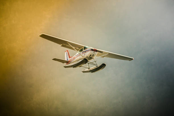 Old seaplane in flight stock photo