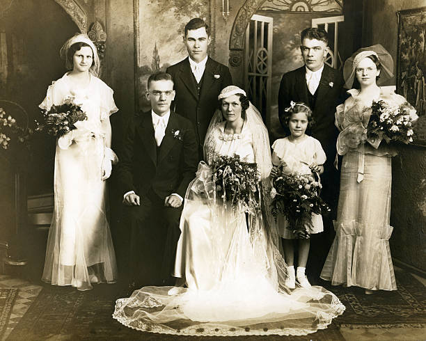 Old sepia photograph of a group at a wedding stock photo