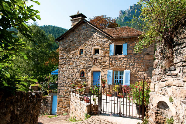 Old stone house in a french village Beautiful house in Florac, Cevennes National Park in Occitanie in France. August 9, 2020 stone house stock pictures, royalty-free photos & images