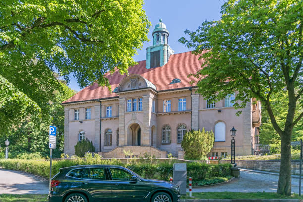 Old Town Hall Nikolassee with charging station for electric cars in Berlin, Germany stock photo