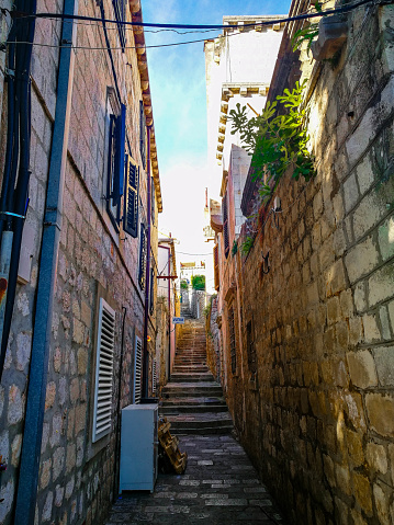 Old Town Narrow Street With Stairs Doors Windows And Flower