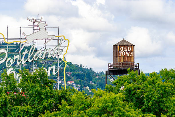 Old Town Portland Oregon Portland, Oregon, United States - June 11, 2016: The White Stag sign, a former advertising sign, greets those traveling into Old Town on the Burnside Bridge. old town stock pictures, royalty-free photos & images