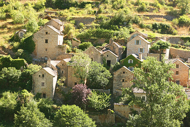 Old village in Gorges du Tarn, Lozere, France Scenic view of an old village, Gorges du Tarn, Lozere, France. gorges du tarn stock pictures, royalty-free photos & images