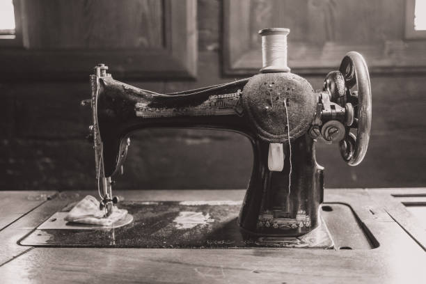 Old vintage sewing machine in an old house. stock photo