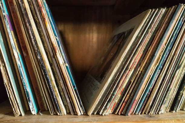 Old Vinyl records in the wooden shelf Old, more than 50 years, Vinyl records in the wooden shelf record analog audio stock pictures, royalty-free photos & images