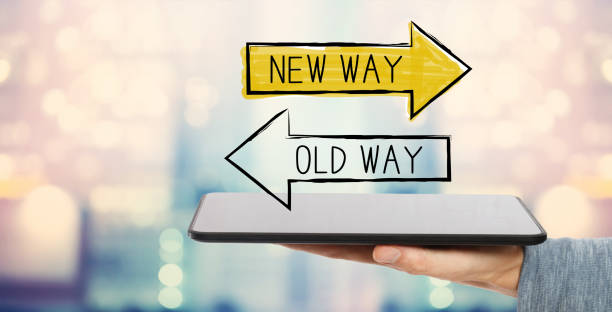 Old way or new way with tablet computer Old way or new way with man holding a tablet computer old vs new stock pictures, royalty-free photos & images