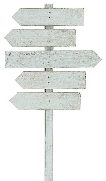 old weathered white wood arrow shaped signboards. - wooden sign board against white imagens e fotografias de stock