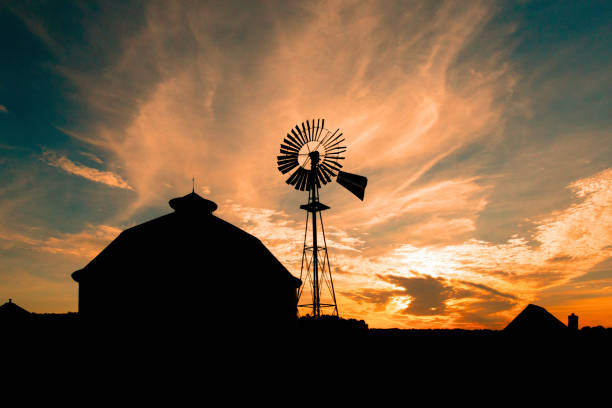 Old weathered windmill at sunrise-Fulton County Park, Indiana stock photo