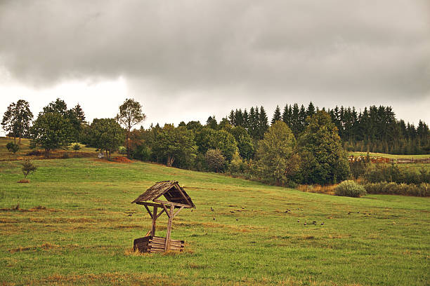 Old well on the field  thomas wells stock pictures, royalty-free photos & images