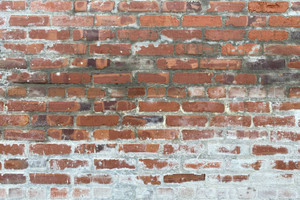 old white washed red brick wall alley stock photo