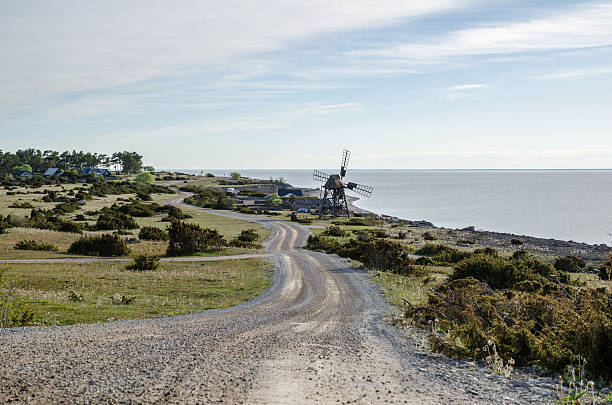 Old windmill by the coast of the swedish island Oland stock photo
