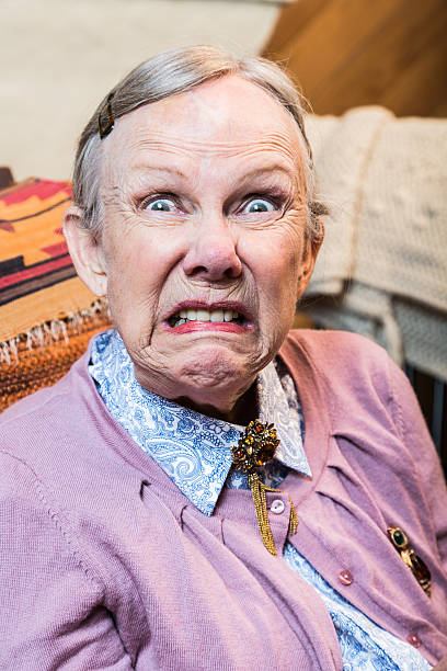 Old Woman Making a Face Woman making a scary face at the camera ugly old women stock pictures, royalty-free photos & images