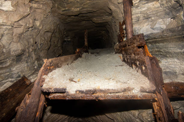 Old wooden dump in an abandoned coal mine tunnel stock photo