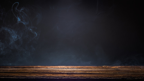 Old wooden platform, podium or table with smoke in the dark.