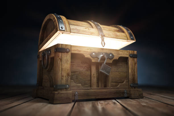 old wooden treasure chest box with  glow from inside - antiguidade imagens e fotografias de stock