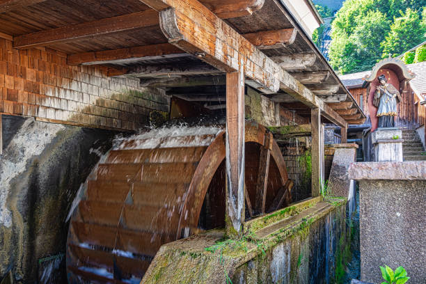 Old wooden Watermill in the city of Salzburg Watermill near the St Peter's Abbey Bakery in Salzburg Old Town water wheel stock pictures, royalty-free photos & images