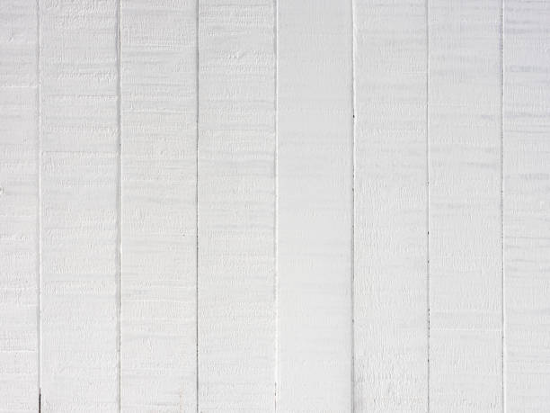 Old worn, weathered, white painted teak wood panel background. stock photo