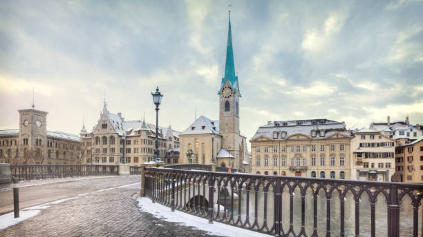Old Zurich town in winter, view on lake Winter landscape of Zurich with lake with bridge on foreground, Switzerland zurich stock pictures, royalty-free photos & images