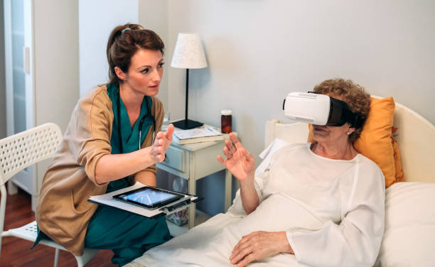 Older patient using virtual reality glasses Older patient using virtual reality glasses to see her spine while female doctor explains virtual reality point of view stock pictures, royalty-free photos & images