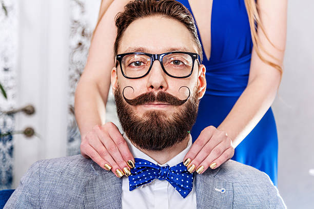Old-fashioned man with a beard and curled mustache stock photo