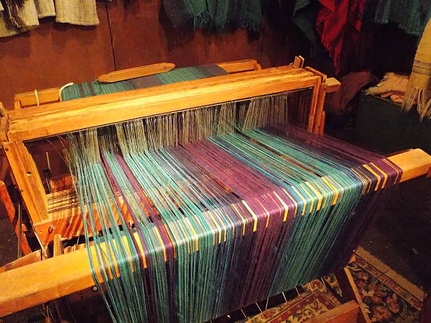 Old-fashioned Wooden Loom with Multi-color Threads stock photo