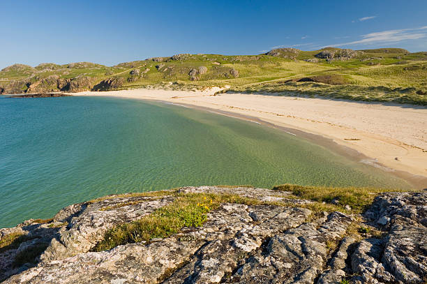 Oldshoremore beach "Oldshoremore beach, near Kinlochbervie in the Scottish Highlands. Clear skies, turqoiuse waters and an empty sandy beach..." caithness stock pictures, royalty-free photos & images
