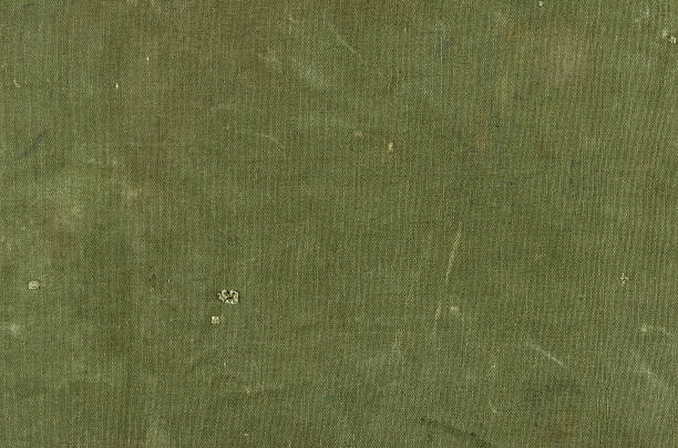 Olive green cotton texture with scratches ans rips Olive green cotton texture with scratches ans rips army stock pictures, royalty-free photos & images