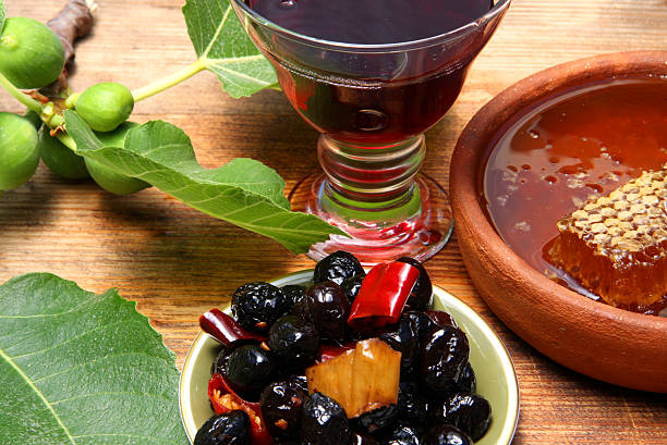 Olives, figs, wine and honey stock photo