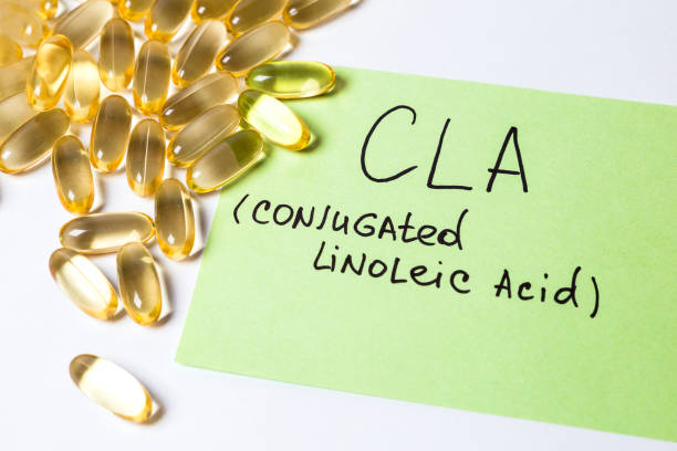 omega 6: conjugated linoleic acid (CLA) in capsules on the white background stock photo