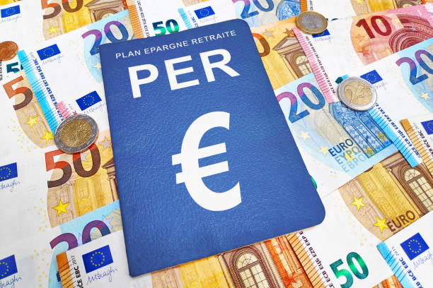PER on a stack of euro banknotes and coins stock photo