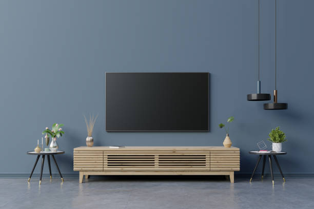 LED TV on the dark blue wall in living room,minimal design. LED TV on the dark blue wall in living room,minimal design.3d rendering camisetas futbol stock pictures, royalty-free photos & images