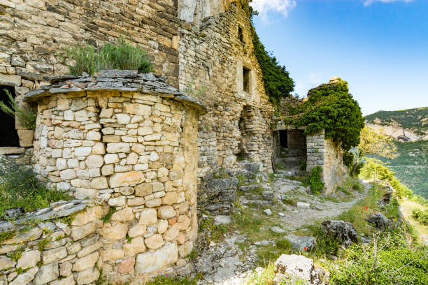 On the Pilgrimage way to Saint Guilhem le Desert The ruins of the troglodyte village of Eglazine in the Gorges du Tarn, France gorges du tarn stock pictures, royalty-free photos & images